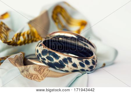Leopard bracelet on silk scarf; fashion accessories