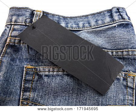 Blue jeans with tags isolated on white background.