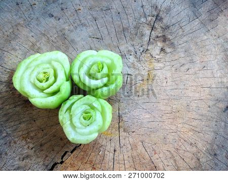 Roses From Rearrange Of Cutting Lettuce On Wooden Plate Or Chopping Block
