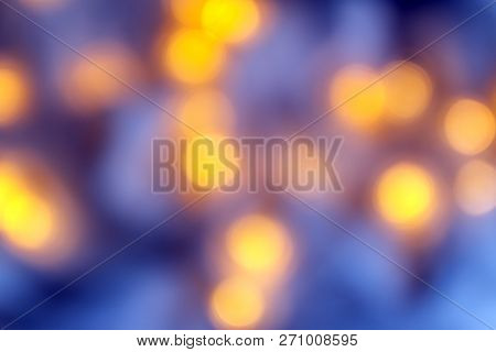 Background Of Blurry Pink-purple-lilac Lights Of The Christmas-tree Garland On The Dark. Copy Space