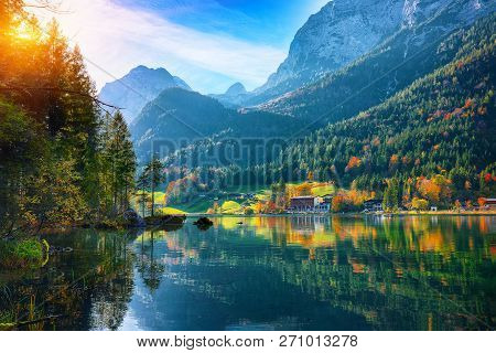 Fantastic Autumn Sunset Of Hintersee Lake. Beautiful Scene Of Trees Near Turquoise Water Of Hinterse