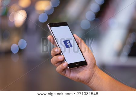 Chiang Mai, Thailand - Oct. 28,2018: Man Holding Huawei With Facebook App On The Screen. Facebook Is