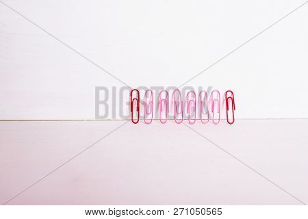 Office Supplies.the Composition Row Of Multi-colored Paper Clips On Pnk, Pastel Background.colorful 