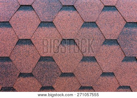 Red Roofing Made Of Soft Shingles. Close-up.