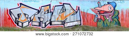 Full And Acomplished Graffiti Artwork. The Old Wall Decorated With Paint Stains In The Style Of Stre