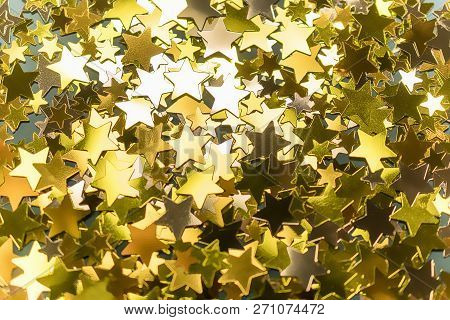 Golden Confetti Stars Scattered On The Surface.