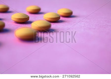 Small Yellow Orange Beautiful Medical Pharmaceptic Round Pills, Vitamins, Drugs, Antibiotics On A Pi