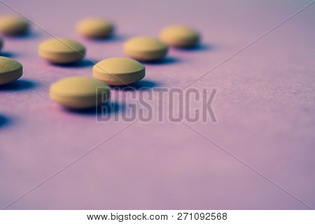 Small Yellow Orange Beautiful Medical Pharmaceptic Round Pills, Vitamins, Drugs, Antibiotics On A Pi