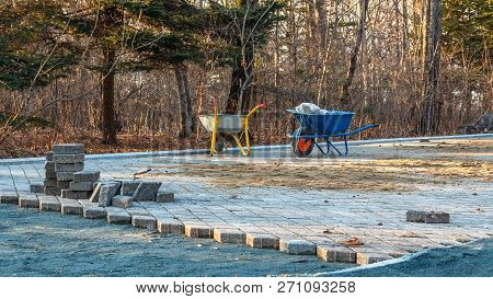 Construction Site And Paving On A Walking Path In A Public Park. Scene Of Preparatory Work With Cart