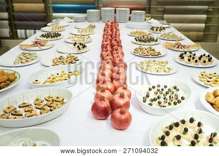 Party Event Buffet Table With Assortment Of Canapes And Pomegran