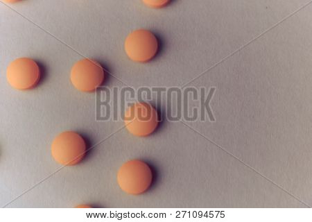 Small Yellow Orange Beautiful Medical Pharmaceptic Round Pills, Vitamins, Drugs, Antibiotics On A Pi