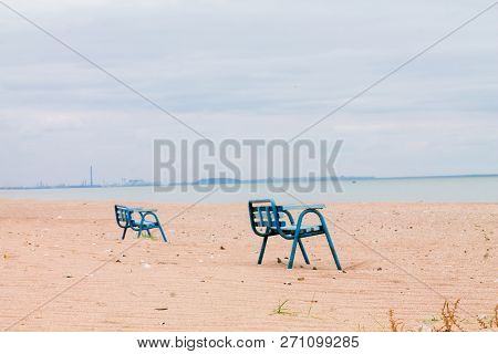 Lonely Benches In An Abandoned Village In The Area Of Hostilities In Ukraine. View From The Sea Of A
