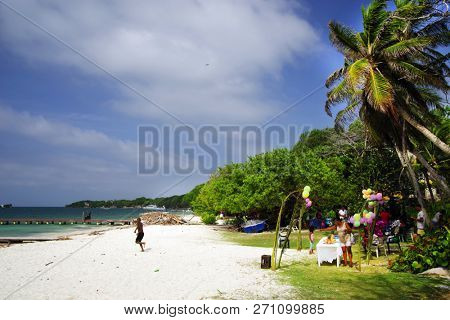 ISLA GRANDE, ROSARIO ARCHIPELAGO, COLOMBIA, 8 AUGUST, 2018: Tourists enjoying the Carribean landscape of Isla Grand, Colombia, South America