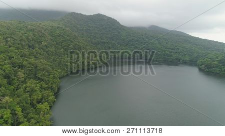 Aerial View Of Lake Bulusan In The Mountains With Green Rain Forest. Lake Hidden In The Jungle Mount