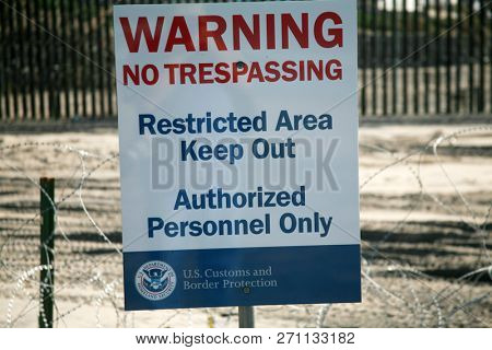 San Ysidro, California 11/26/2018: US Government Warning signs. Warning signs and Caution Tape from government agencies regarding the US/Mexico border.