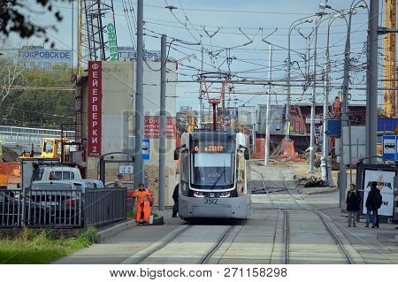 Moscow, Russia - October, 2015: Tram On The Volokolamsk Highway On A Background Of Building Intercha