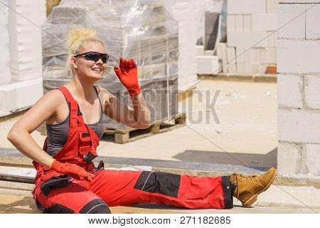 Woman Taking Break On Construction Site
