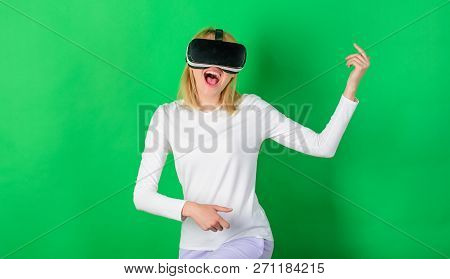 Amazed Young Woman Touching The Air During The Vr Experience. Pretty Woman Playing Game In Virtual R