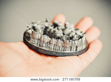 Man Is Holding Object Printed On Metal 3d Printer.