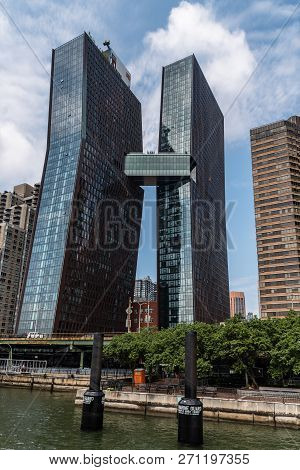 New York City, Usa - June 24, 2018: Low Angle View Of Modern Apartment Buildings With Skybridge Desi
