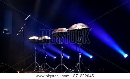 Four Hangs Soyat On Stage They Shine A Blue Spotlight.
