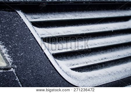 The Frozen Grille Of The Car. The Silver Grille Of The Car In The Snow