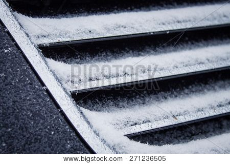 The Frozen Grille Of The Car. The Silver Grille Of The Car In The Snow