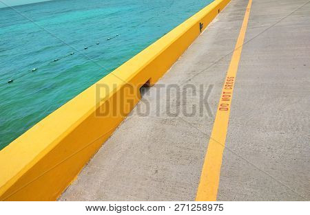 The Yellow Do Not Cross Line On The Seafront