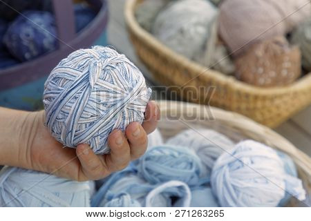 Womans Hand Holding A Blue Ball Of Matte Crumble