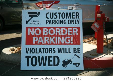 San Ysidro, California - 11/26/2018: Signs seen at the US/Mexico border. Warning, Do not cross, Directional and Location signs at the border between the USA and Mexico. Close to San Diego California.