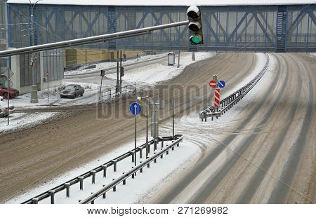 The Gap For The Turn In The Separation Fence On The Road And A Traffic Light With A Green Enable Sig