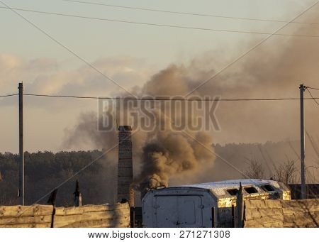 Smoke From Industrial Chimneys Against The Blue Sky. Pollution.