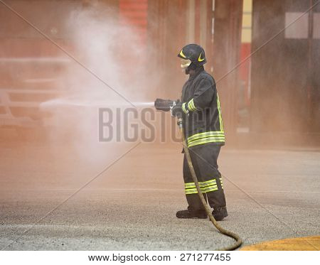 Firefighter Extinguishes The Big Fire With Foamed Hydrant