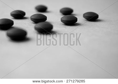 Little Beautiful Medical Pharmaceptic Round Pills, Vitamins, Drugs, Antibiotics On A Black And White