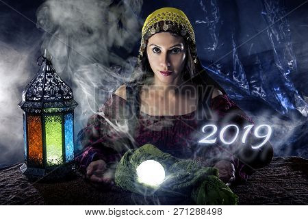 Female Fortune Teller Or Psychic Reading With A Cystal Ball Predicting The Future Of The Year 2019