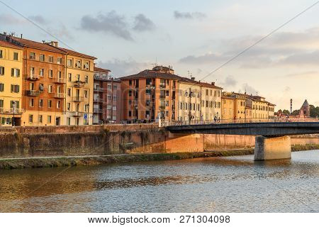 View On Embankment Of Arno River And Solferino Bridge At Sunset In Pisa, Italy