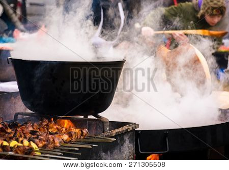 Hecha, Ukraine - Jan 27, 2018: Pork Butchers Competition. Boiling Cauldron On Fire. Meat Cooking On 