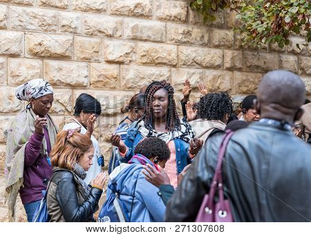 Jerusalem, Israel, November 24, 2018 : A Group Of Pilgrims Believers Make A Mass Prayer Near The Out