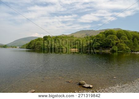 Shore Of Grasmere Looking Towards Helm Crag In Lake District