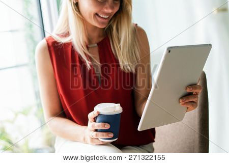 Businesswoman reading thew news from a digital tablet