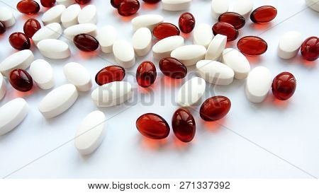 Assorted Colorful Pharmaceutical Medicine Pills, Tablets And Capsules On White Background. Pharmacy 