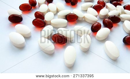 Assorted Colorful Pharmaceutical Medicine Pills, Tablets And Capsules On White Background. Pharmacy 