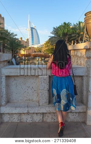 Dubai, Uae - Nov 12, 2018: View From Back Of Young Tourist Woman Looking At Burj Al Arab From Madina