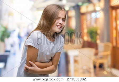 Young beautiful girl over isolated background with hand on stomach because nausea, painful disease feeling unwell. Ache concept.
