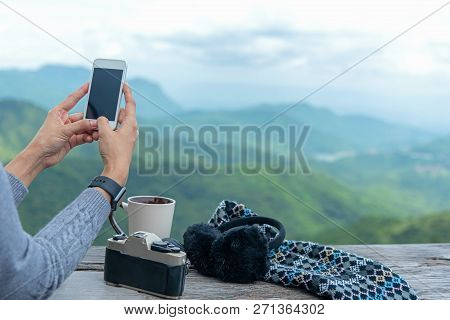 Traveler Woman Using Smartphone And Drinking  Coffee And Tea And Take A Photo And Relax In Sun Sitti