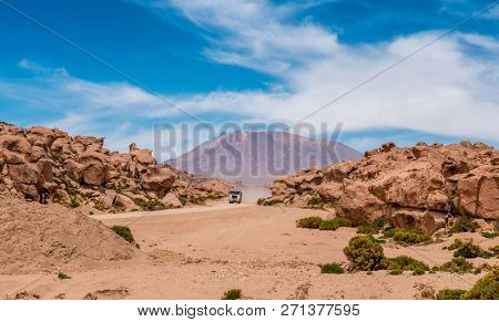 Jeep riding in sunshine mountanious Bolivia desert