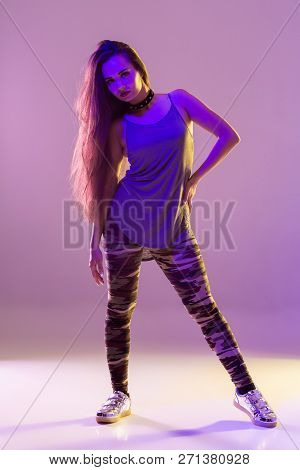 Modern Style Dancer Posing On Studio Background. Hip Hop, Jazz Funk, Dancehall