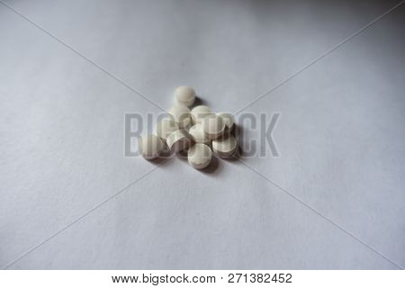 Some Small White Round Vitamin K Tablets