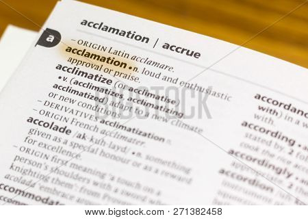 The Word Or Phrase Acclamation In A Dictionary Highlighted With Marker.