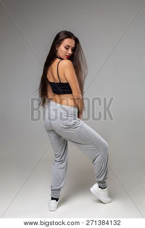 Modern Style Dancer Posing On Studio Background. Hip Hop, Jazz Funk, Dancehall